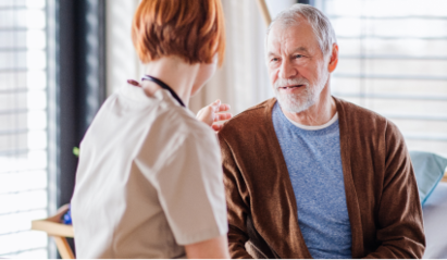 A clinician speaks to a patient 