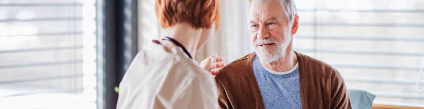 A clinician greets a patient in her office